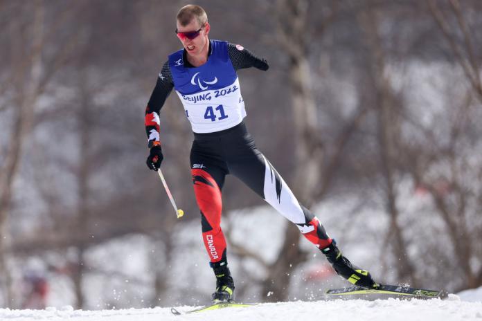 A male skier competes in Para cross-country skiing